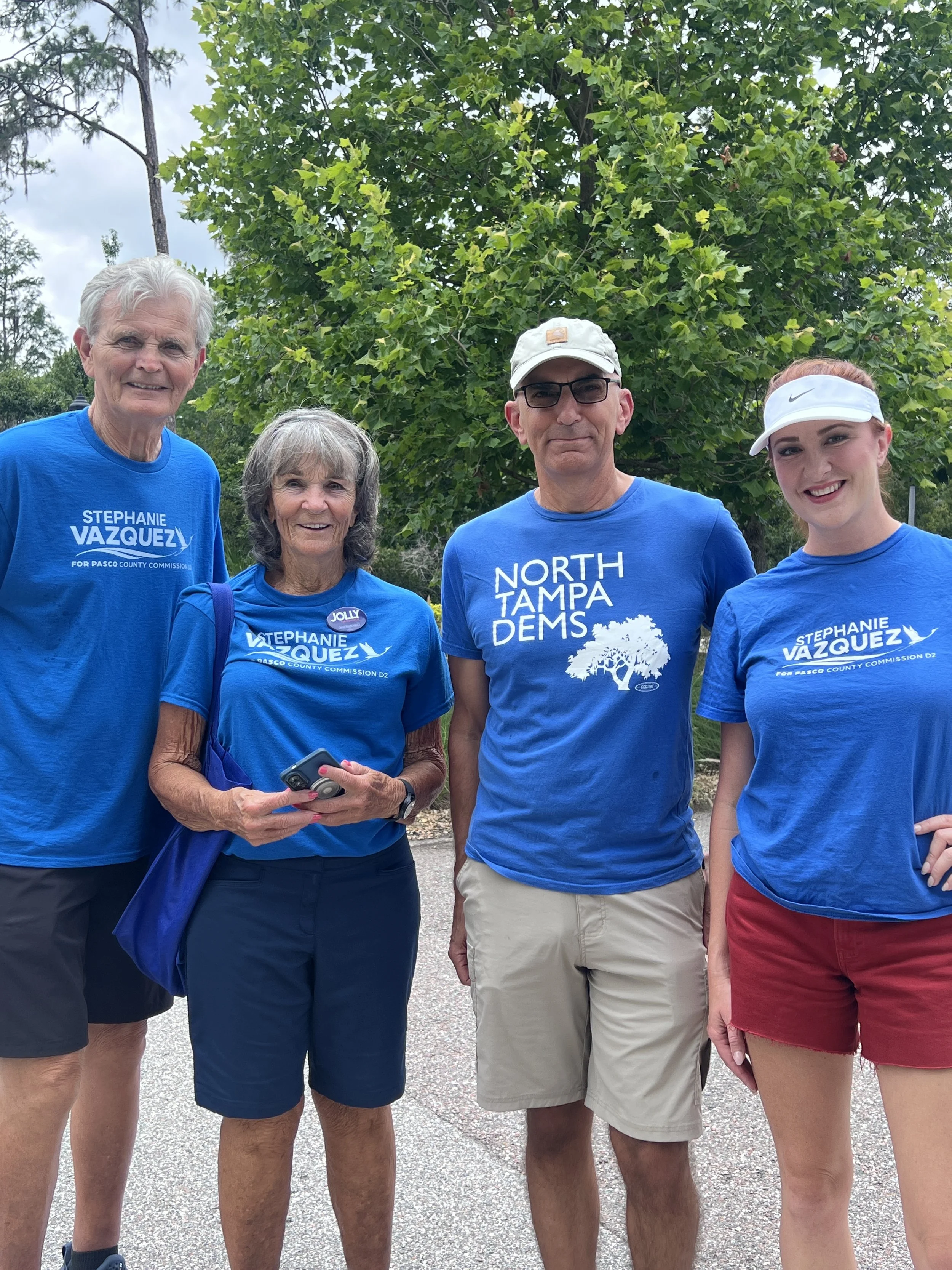 group of volunteers standing together in blue shirts supporting stephanie vazquez's campaign