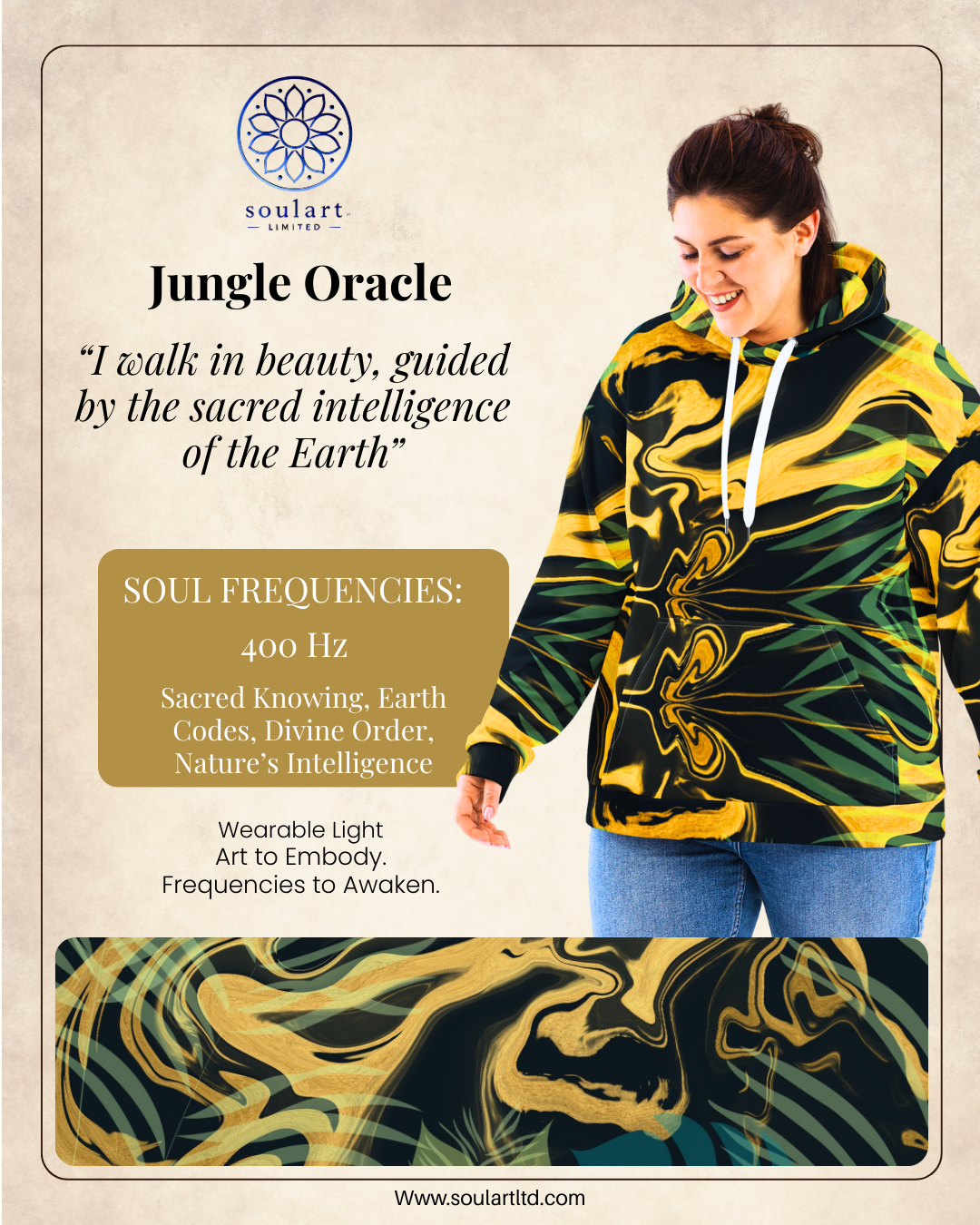 A woman in a black, yellow, and green abstract-patterned hoodie standing with her head slightly bowed, smiling, next to a promotional flyer for Soulart Limited featuring the Jungle Oracle and its associated soul frequencies.