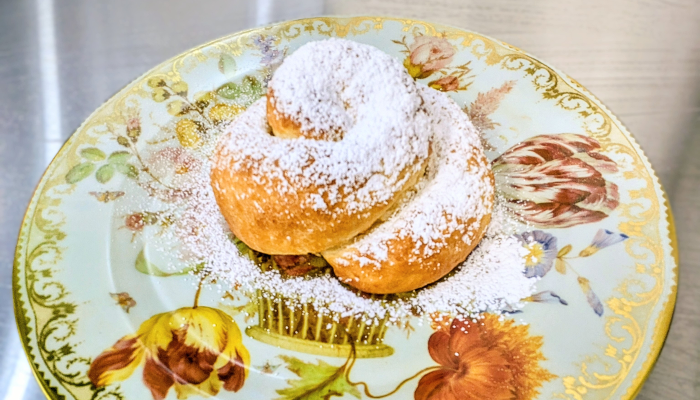 mallorca Roll of soft fluffy sweet bread covered in powdered sugar