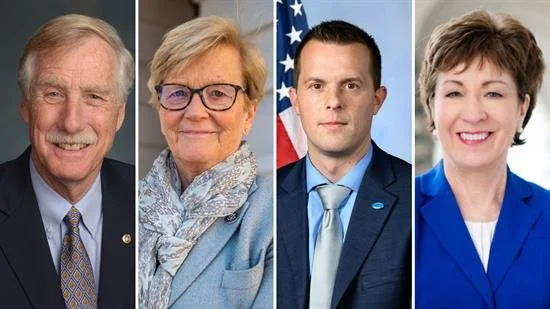 Four professional individuals in formal attire standing side by side, two men and two women, with neutral or professional backgrounds.