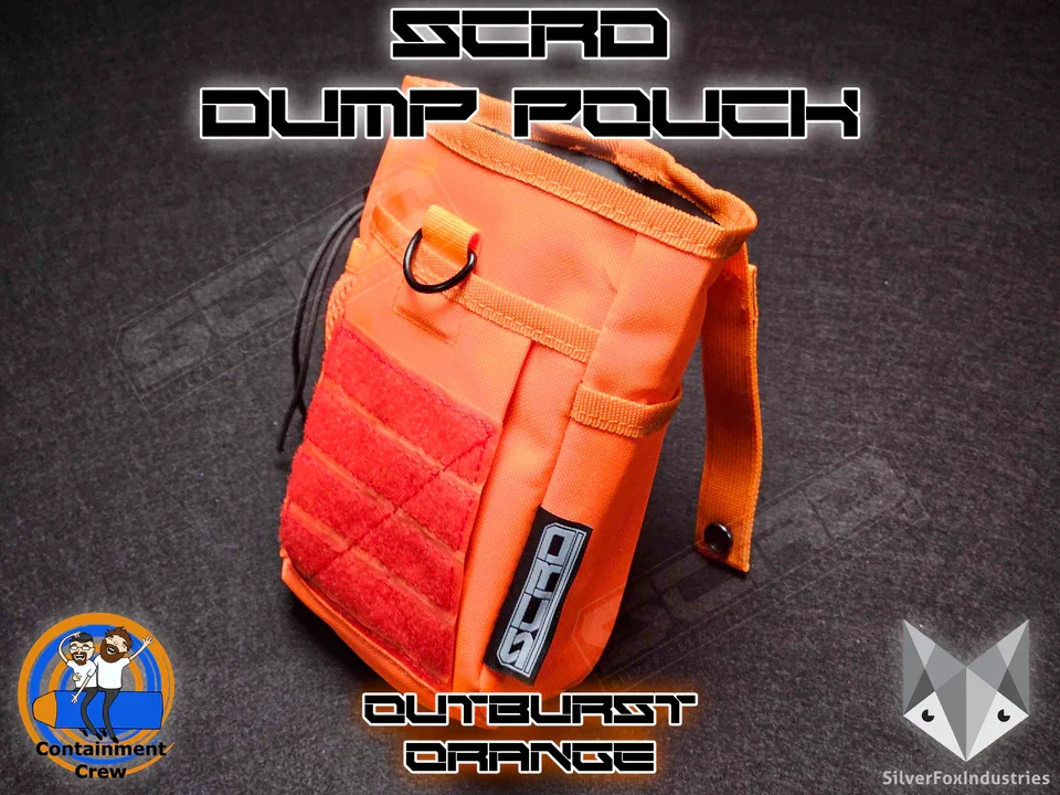 Orange Scrub Dump Pouch with red Velcro and black attachment rings on a dark surface, with logos and text indicating it's for Outburst Orange by Outburst Industries, featuring a Containment Crew badge and Silver Fox Industries logo in the bottom corners.