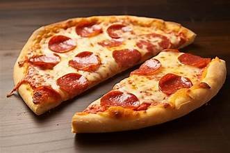 Two slices of pepperoni pizza on a dark surface