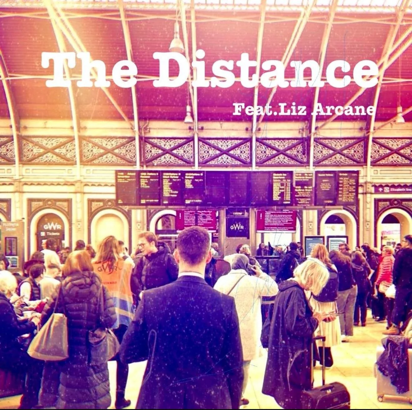 Crowded train station with people and electronic departure boards; text overlay reads 'The Distance Feat. Liz Arcane.'