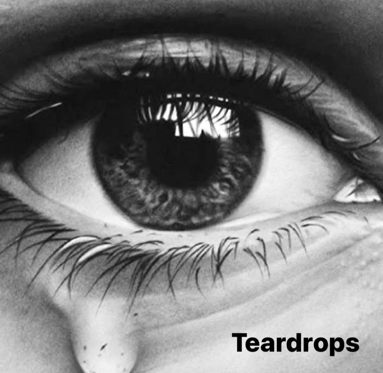 Close-up drawing of an eye with a single tear falling down, accompanied by the word "Teardrops."