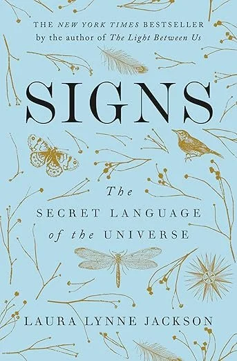 Book cover titled "Signs: The Secret Language of the Universe" by Laura Lynne Jackson, featuring illustrations of birds, insects, and botanical elements on a light blue background.