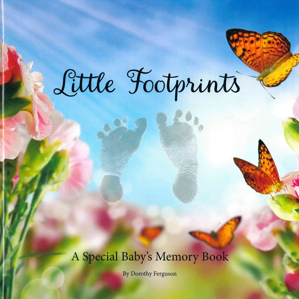 A book cover titled 'Little Footprints: A Special Baby's Memory Book' by Dorothy Ferguson, featuring a background of pink flowers, green leaves, orange butterflies, and a blue sky with clouds, and faint footprints in the sky.