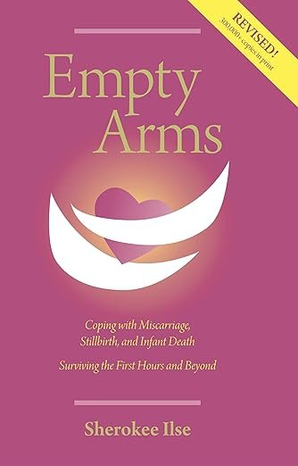 Book cover titled 'Empty Arms' by Sherokee Ilse with a pink background, a stylized heart inside a crescent smile, and a yellow banner indicating it is a revised edition.
