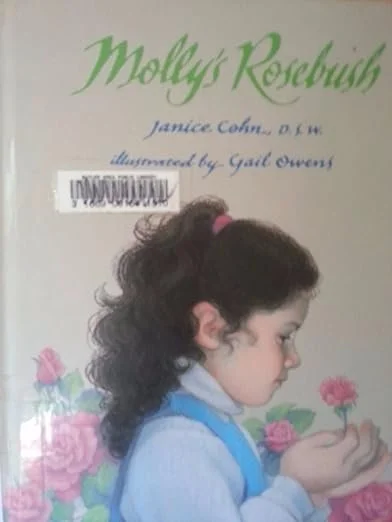 Book cover titled 'Molly's Rosebush' with an illustrated girl holding a pink flower, written by Janice Cohen and illustrated by Gail Owens.