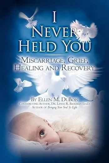 Book cover titled 'I Never Held You: Miscarriage, Grief, Healing and Recovery' by Ellen M. DuBois, featuring white doves flying against a blue sky and a young girl lying down.