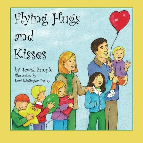 Book cover titled 'Flying Hugs and Kisses' featuring a man with six children, one holding a red heart-shaped balloon, others holding balloons and hugging, with a light blue background and yellow border.