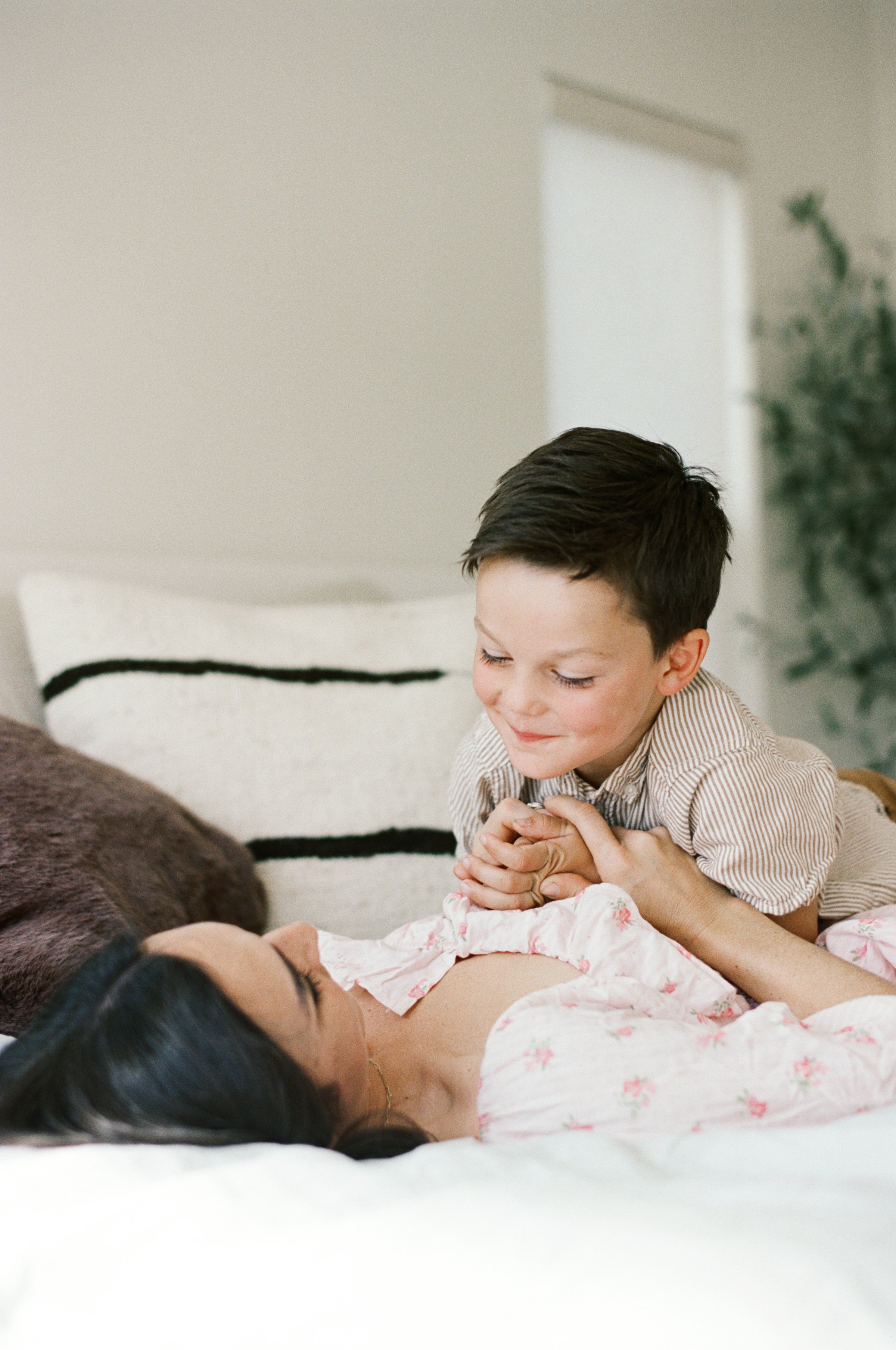 mother and son snuggle film photography