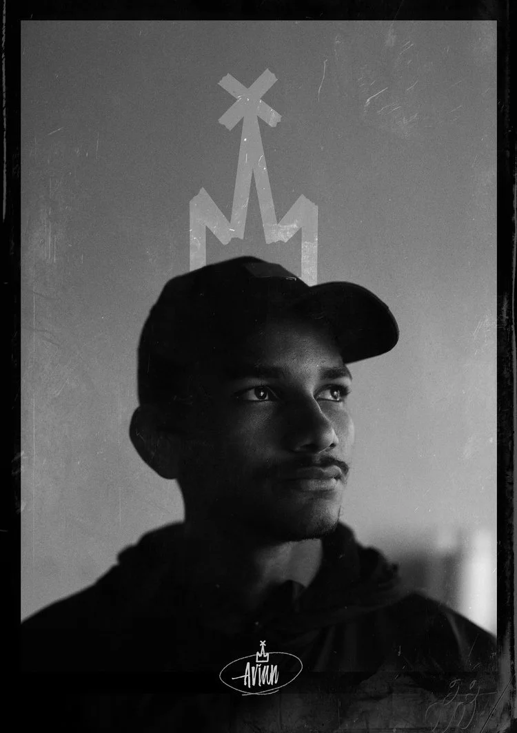 Black and white photo of a young man skater wearing a baseball cap. He is looking slightly upward with a thoughtful expression. There is a stylized rocket and explosion graphic above his head. The word "Ariyan" appears at the bottom. Sk8 Liborius