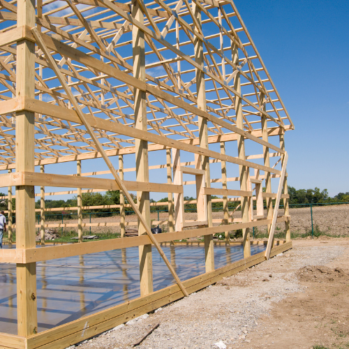 Wooden frame of a building under construction on a sunny day