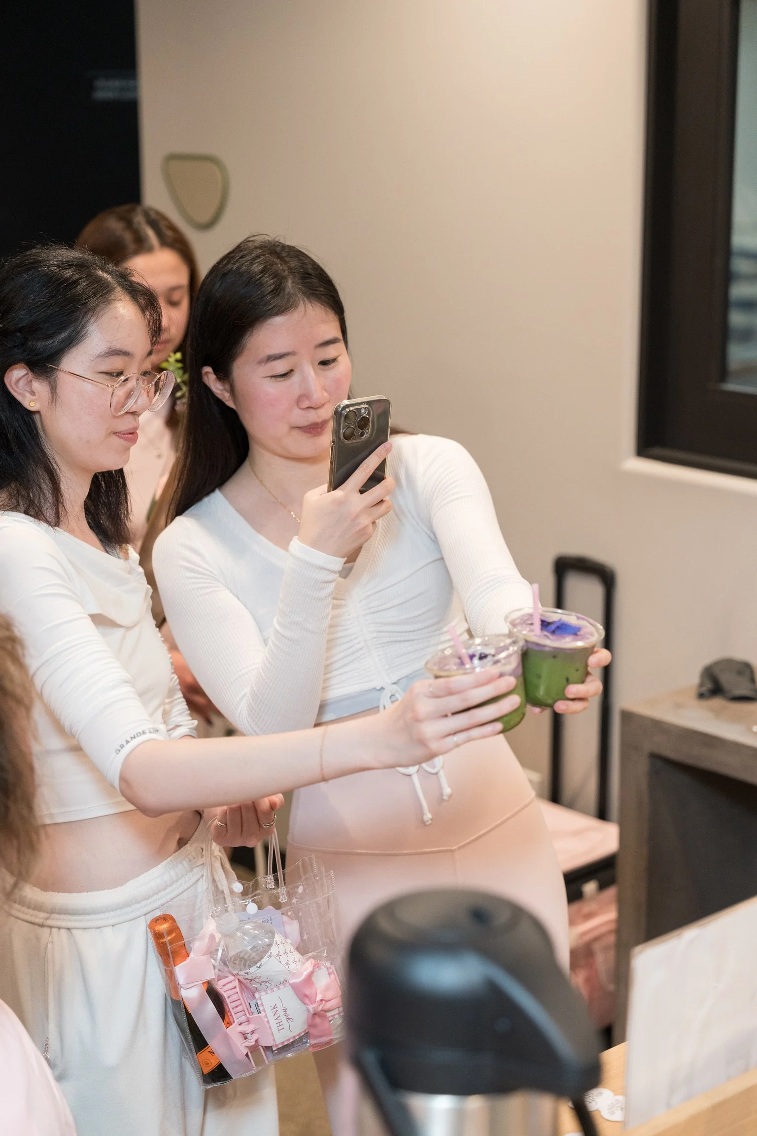 Guests holding drinks made by The Soft Spot at a private catered event