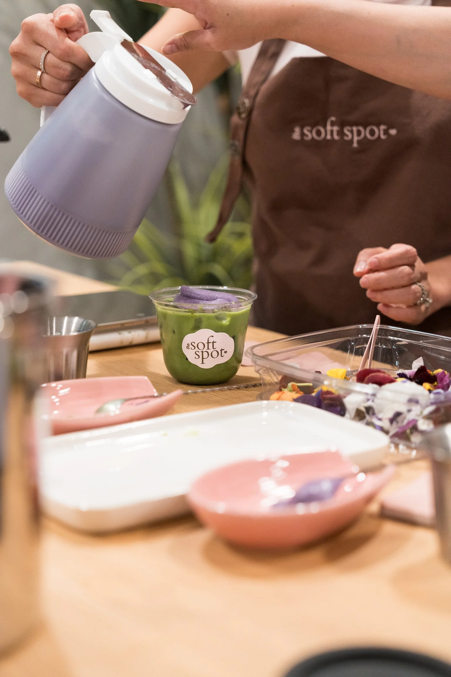 Barista preparing matcha drinks on The Soft Spot mobile bar for a private event