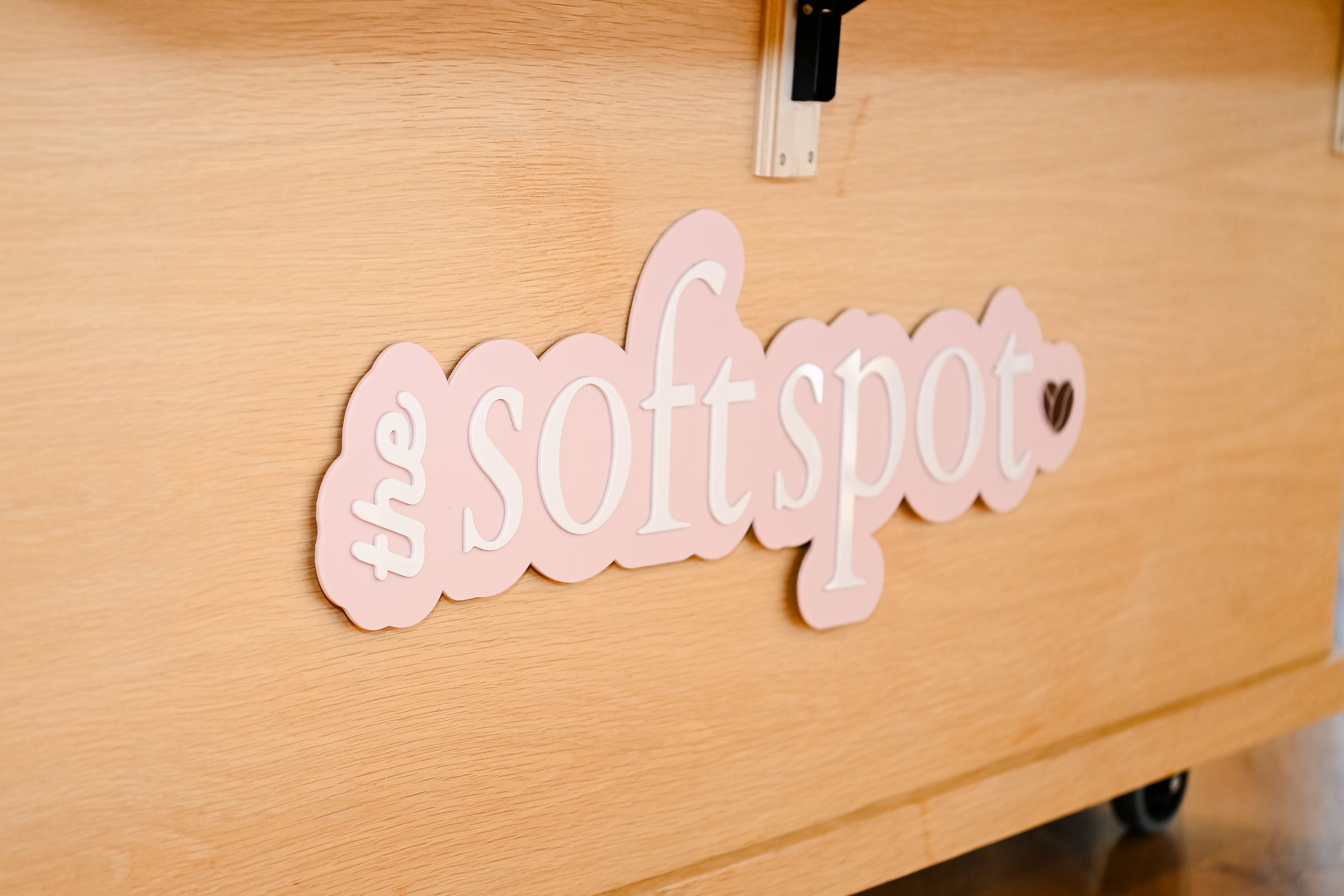 Logo details on The Soft Spot catering bar featuring branded elements
