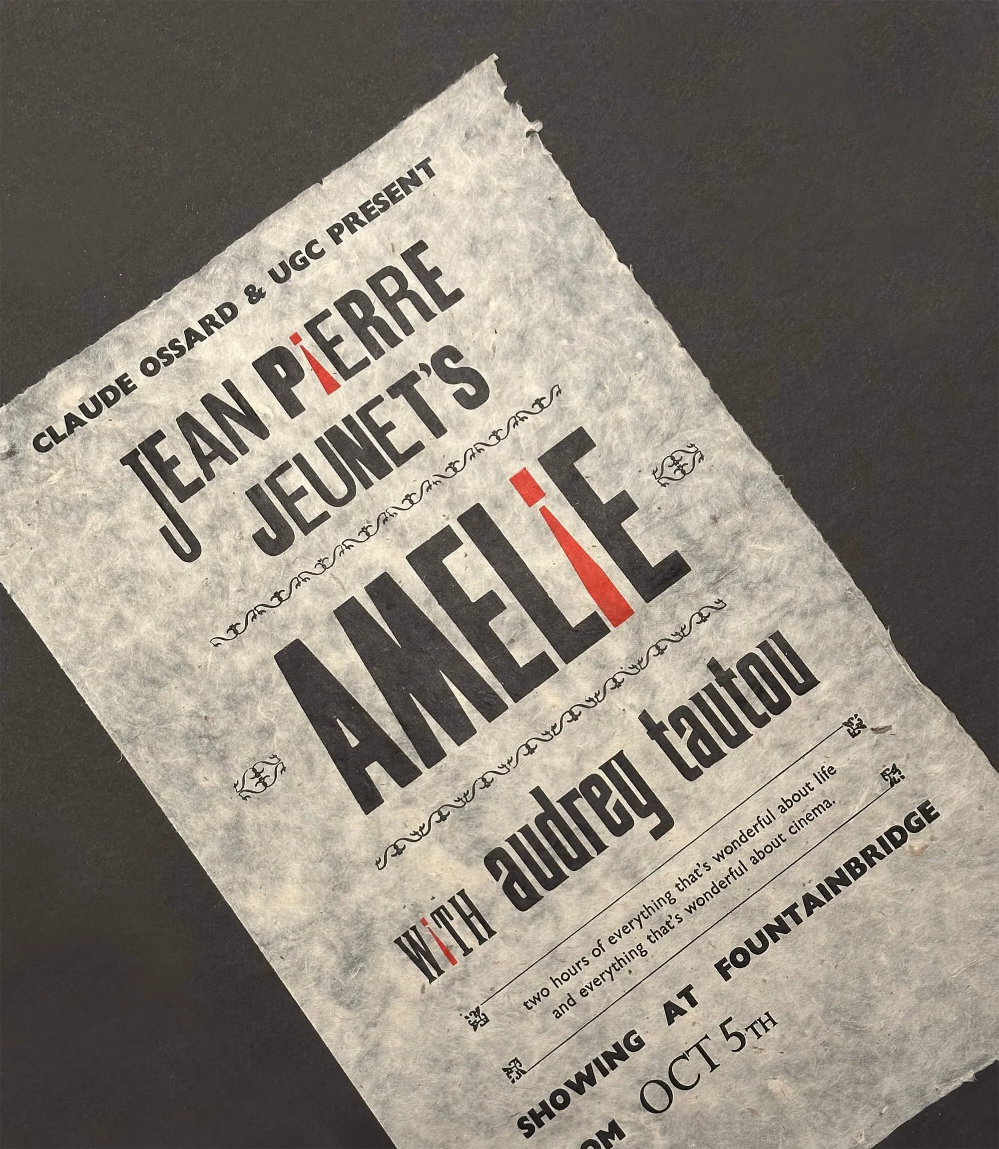 A black and white theatrical poster for Jean Pierre Jeunet's film 'Amélie,' with decorative elements and event details at the bottom.
