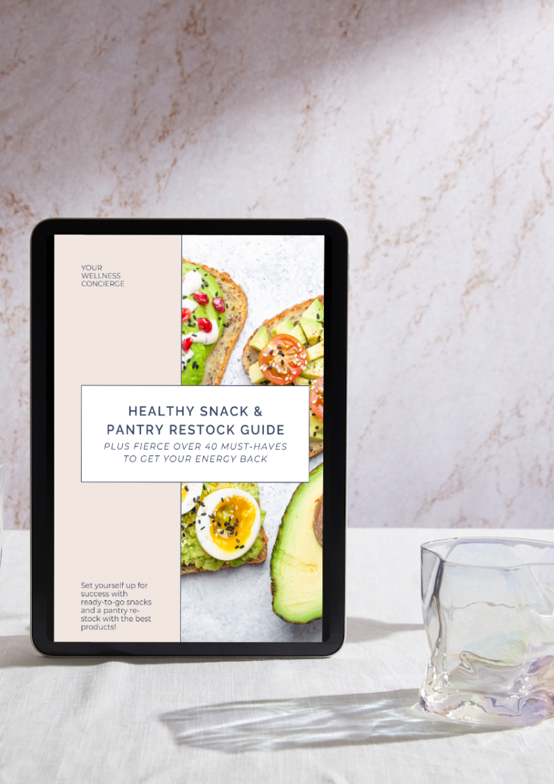 Tablet displaying a digital guide titled 'Healthy Snack & Pantry Restock Guide' with images of avocado toast on a table with a glass nearby.