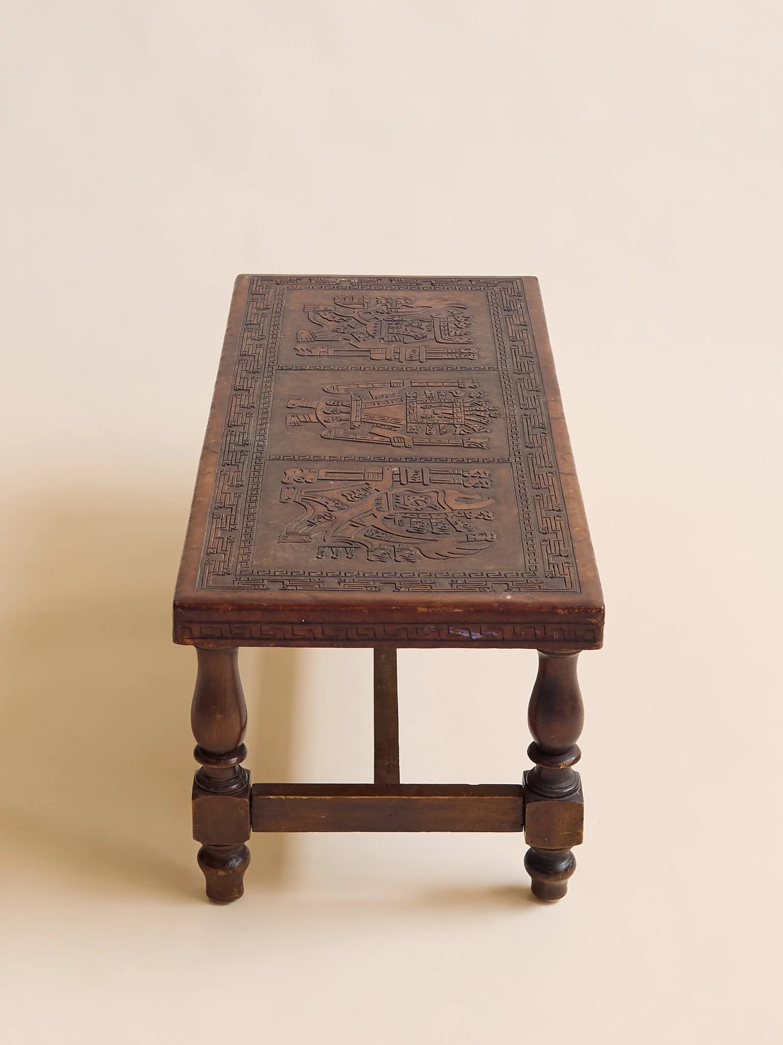 23_TheVintagePeruvianLeatherCarvedCoffeeTable_004.jpg