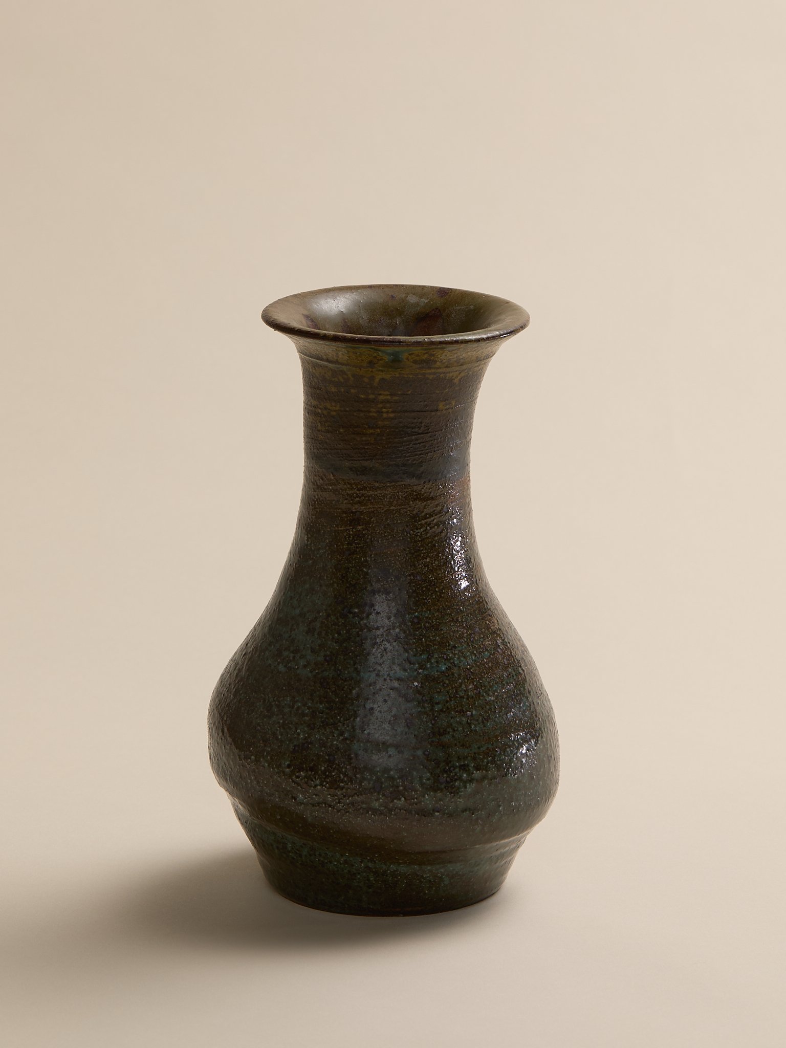 The Vintage Dark Green Studio Pottery Vase with Hints of Blue