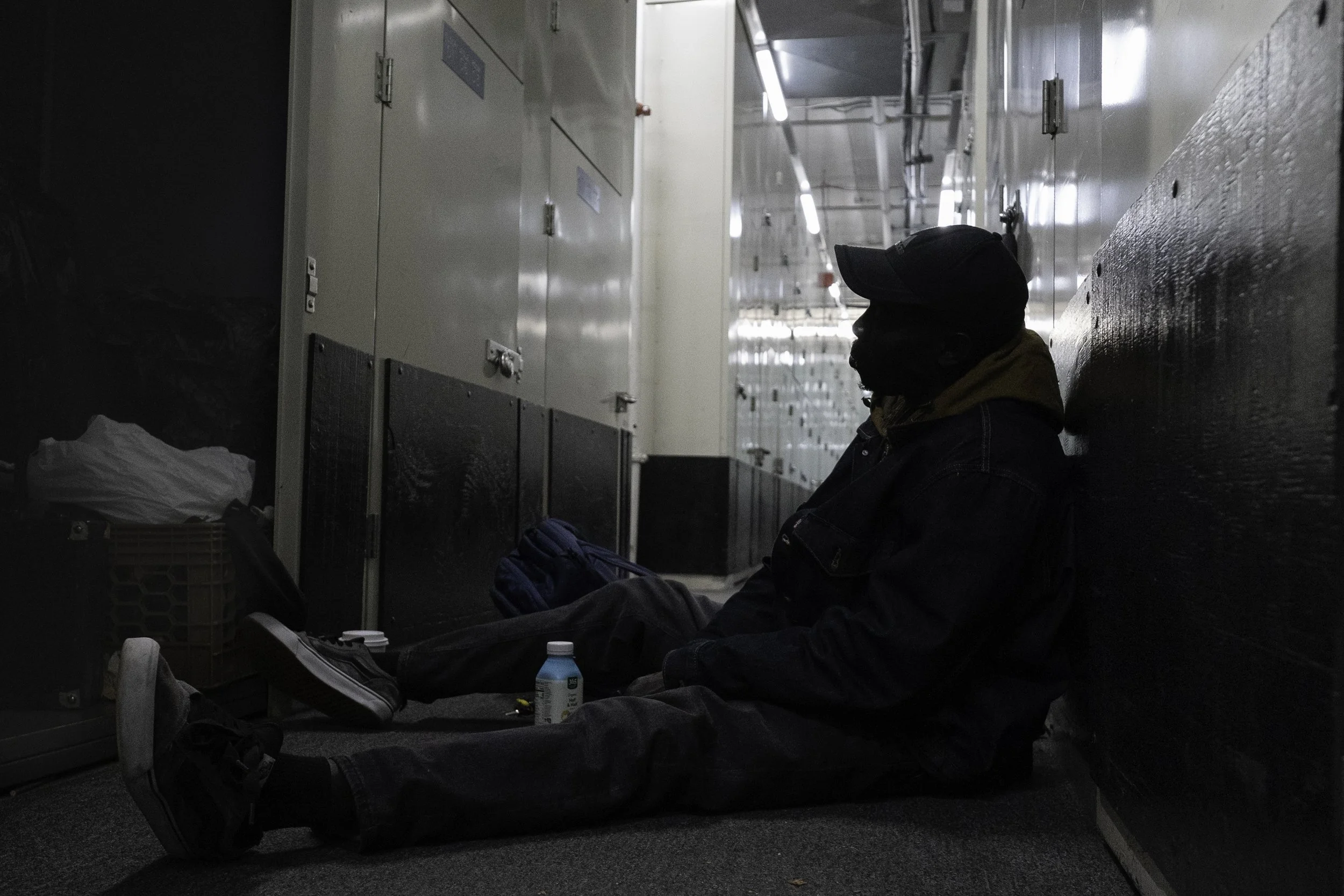Canal Street, October 24, 2025 —Noreyni (a pseudonym) inside a storage room after the long day of street vending.