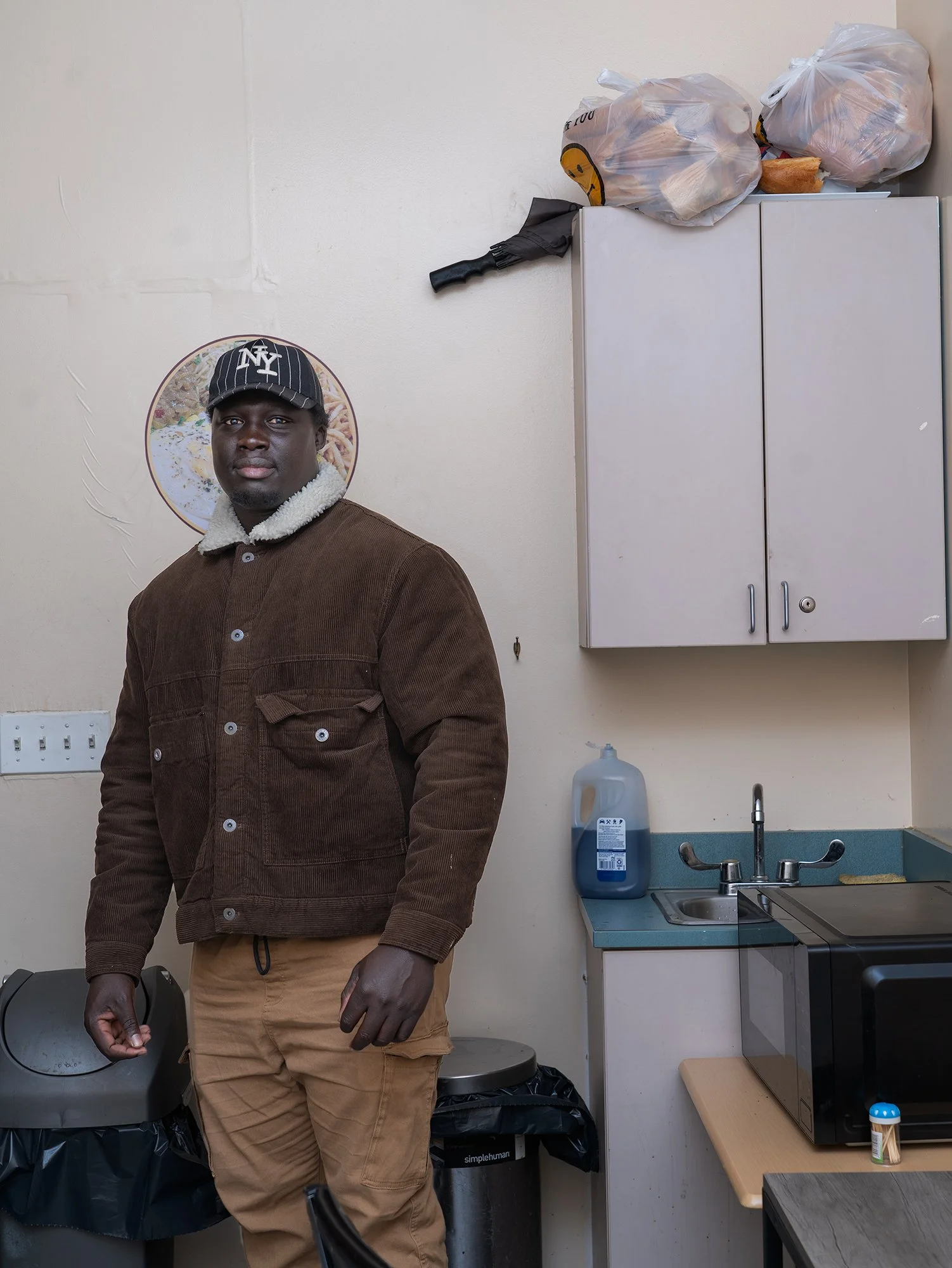 Inside the restaurant on 116th Street in Harlem, January 16, 2025. A baye fall from the street corner on 116th Street , who works as a security guard in Harlem, visited the restaurant on his day off.