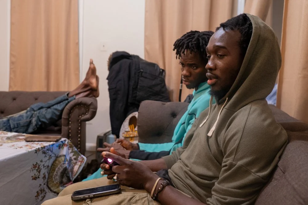 BRONX, N.Y., December 2025 — Mol and Souleye play a soccer video game with other members of the Senegalese immigrant community.
