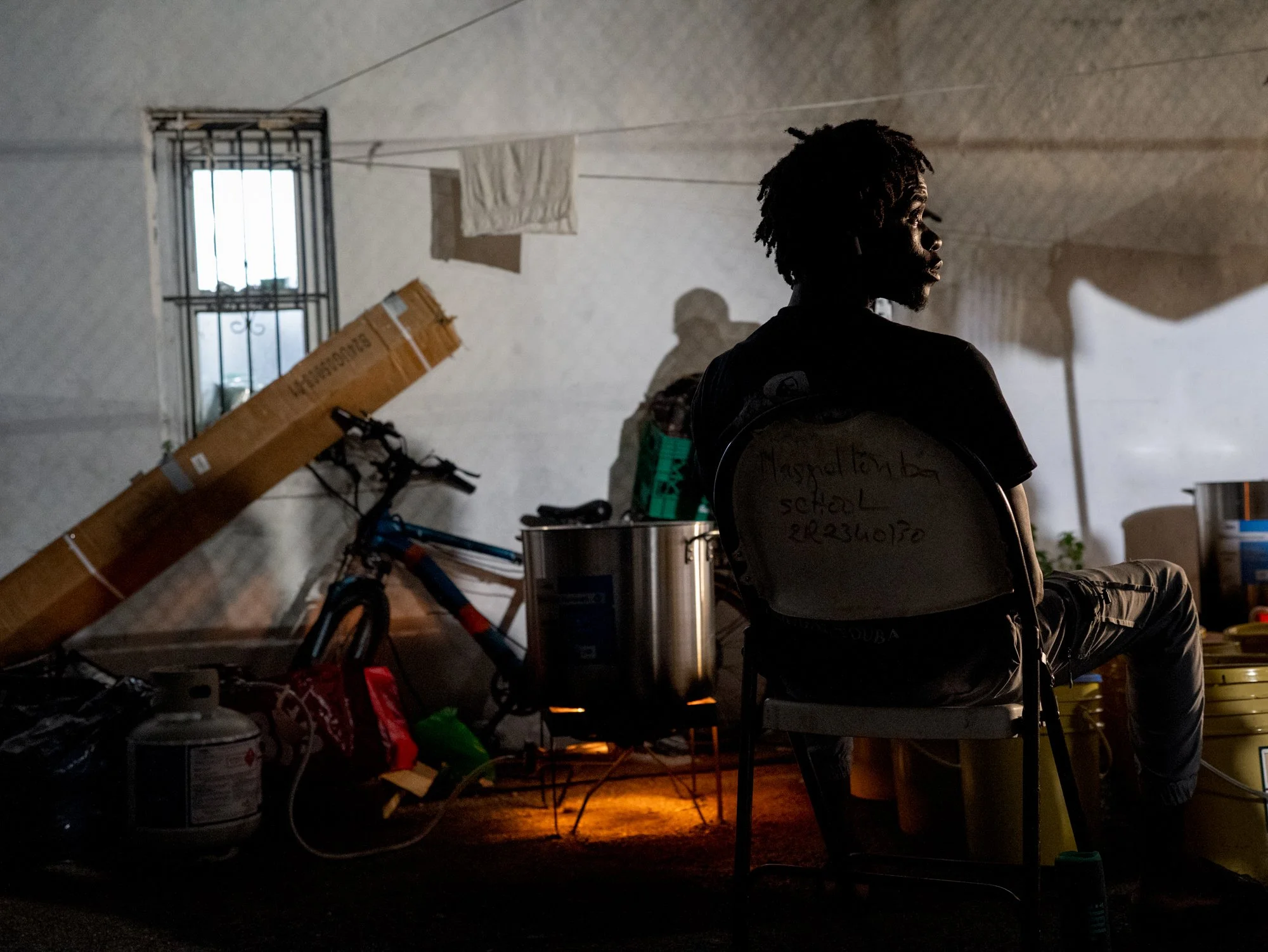 BRONX, N.Y., July 2025 — Mol prepares coffee to serve at a religious gathering. He said he had been fired from his first formal job at a franchise restaurant.