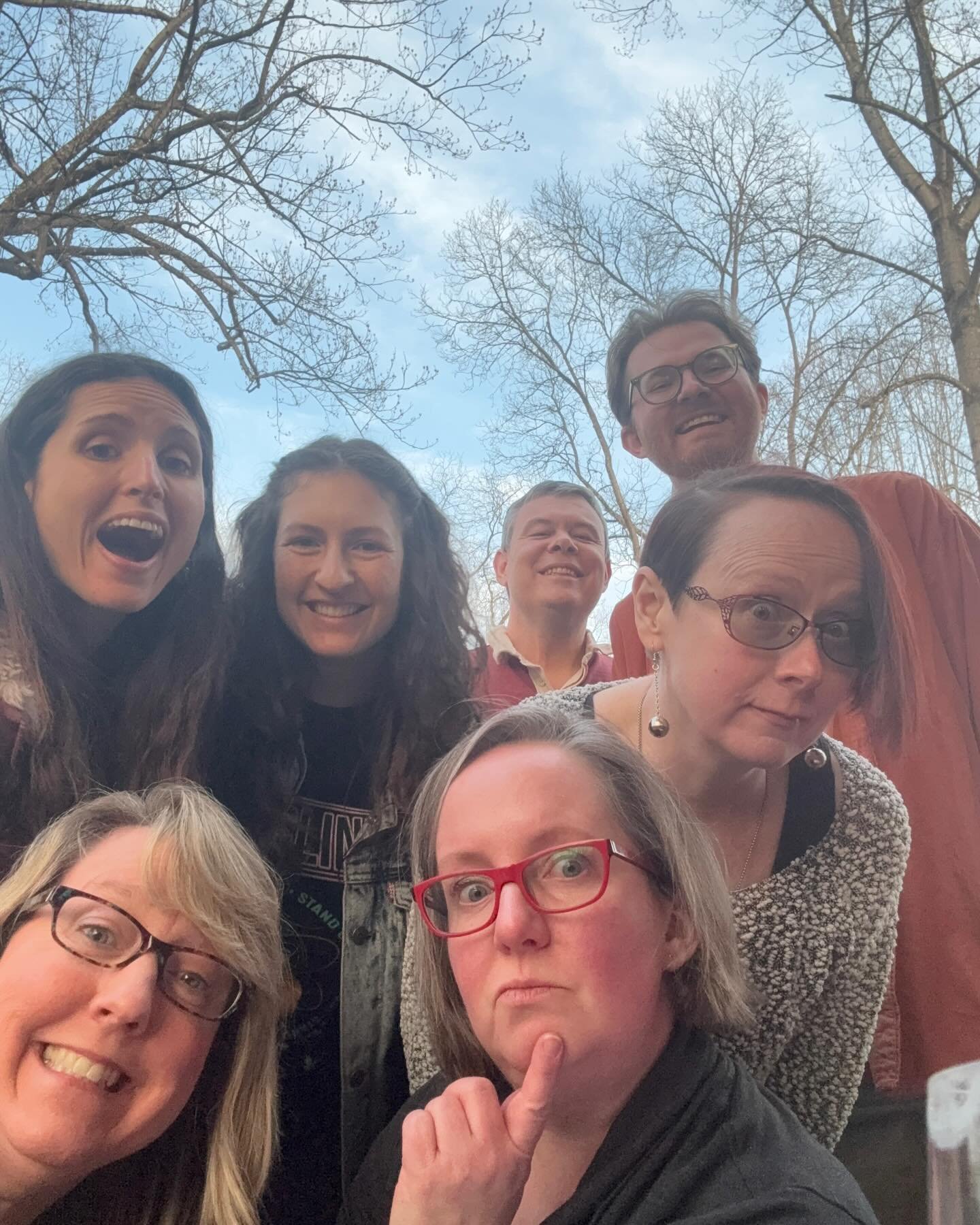Seven people outdoors taking a group selfie with trees and a blue sky in the background. Improv class Charlottesville comedy Decipher Potter's fun date night Bent Theatre