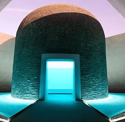 Modern architecture with a dome structure, illuminated entrance, and surrounding water features.