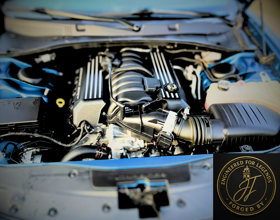 Close-up of a car engine with a badge saying 'Engineered for Legends, Forged by JJ.'