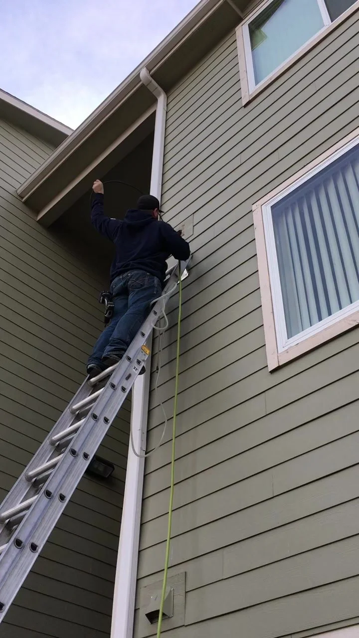 Technician cleaning a second-story dryer vent in Gillette WY