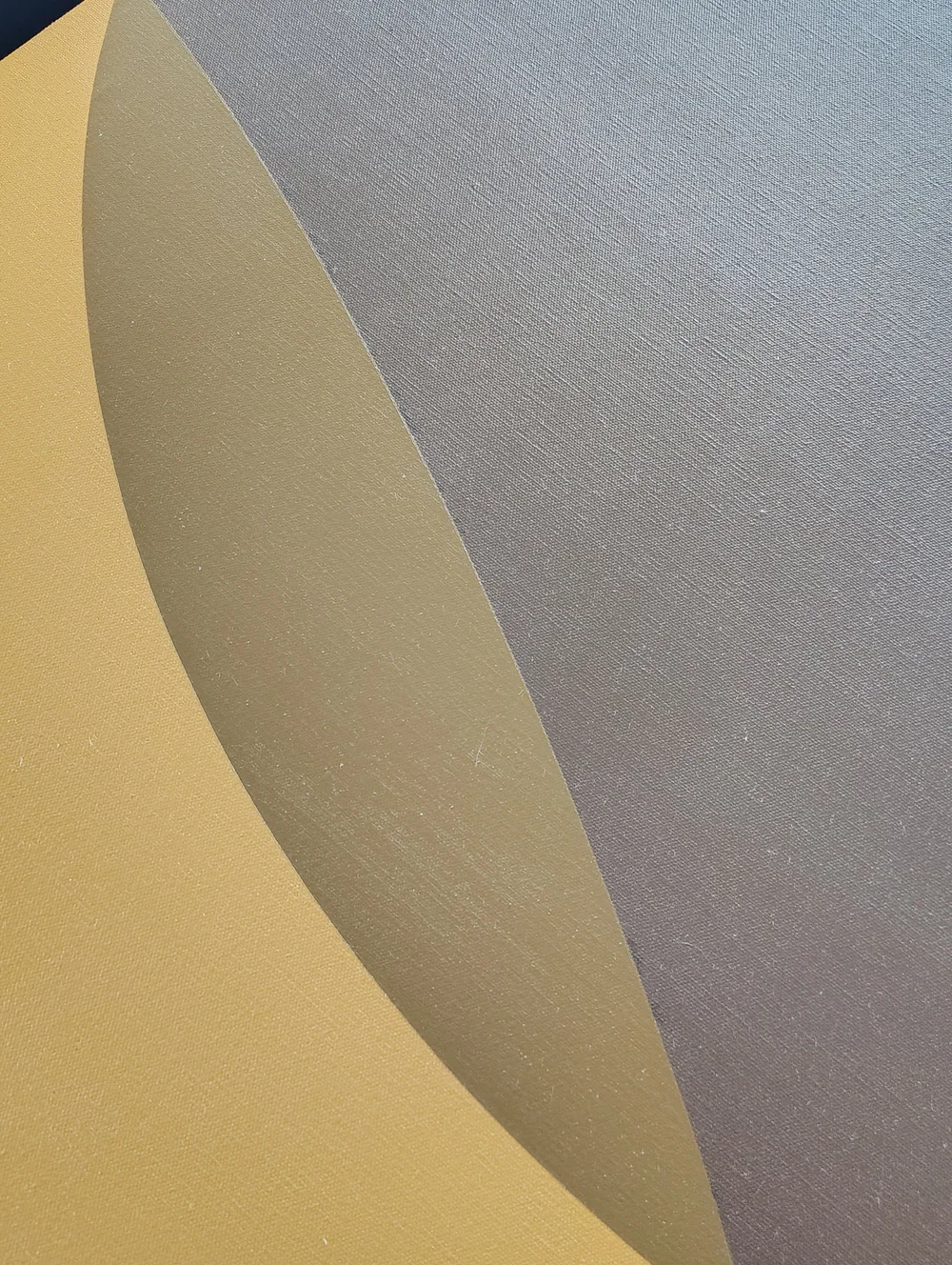 Close-up of the curved earth-tone forms and canvas texture in Yellow Triangle