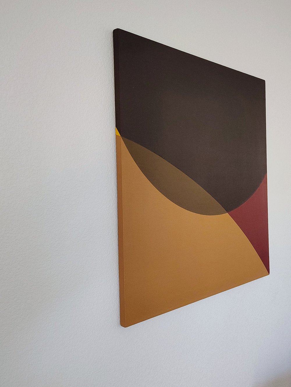 Three-quarter view of Yellow Triangle showing its geometric composition and painted sides