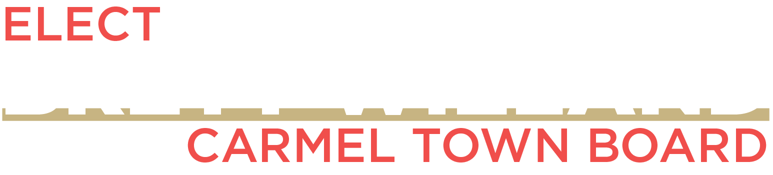 Campaign sign with the text "Elect Brett Wieland Carmel Town Board" in red, black, white, and beige colors.