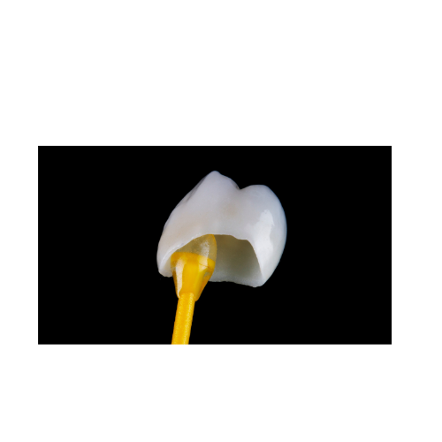 A tooth on a yellow stick against a black background.