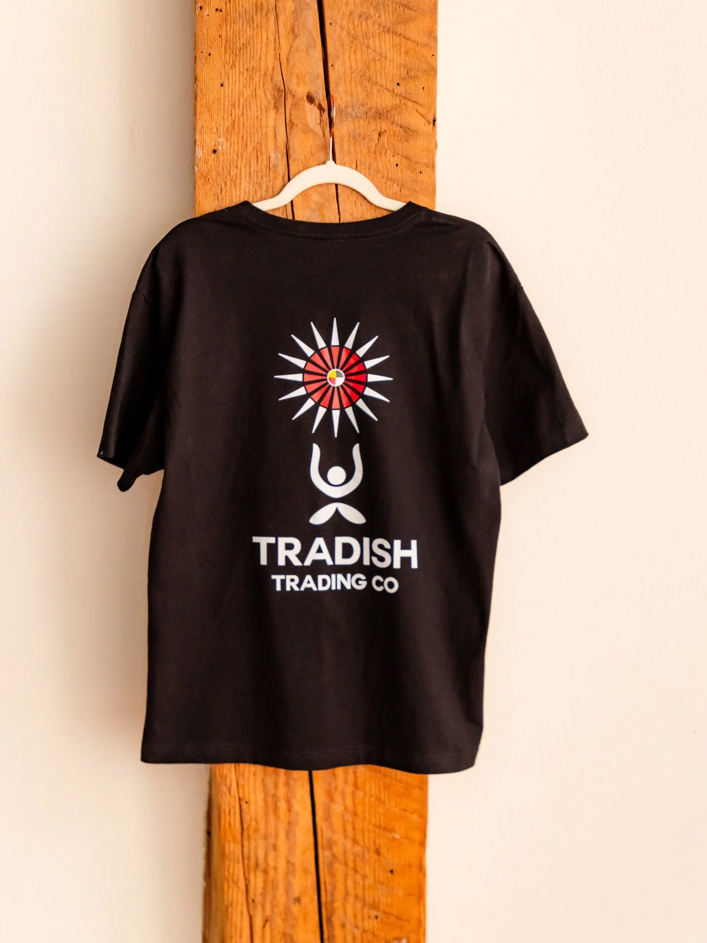 The Tradish logo was designed by @autumn_dawn34 &amp; @kamamajean with the intention to portray the inherent connection our Spirits have to Mother Earth and our Sun. The Tradish logo incorporates a plant-like being reaching toward the Sun Star. The S