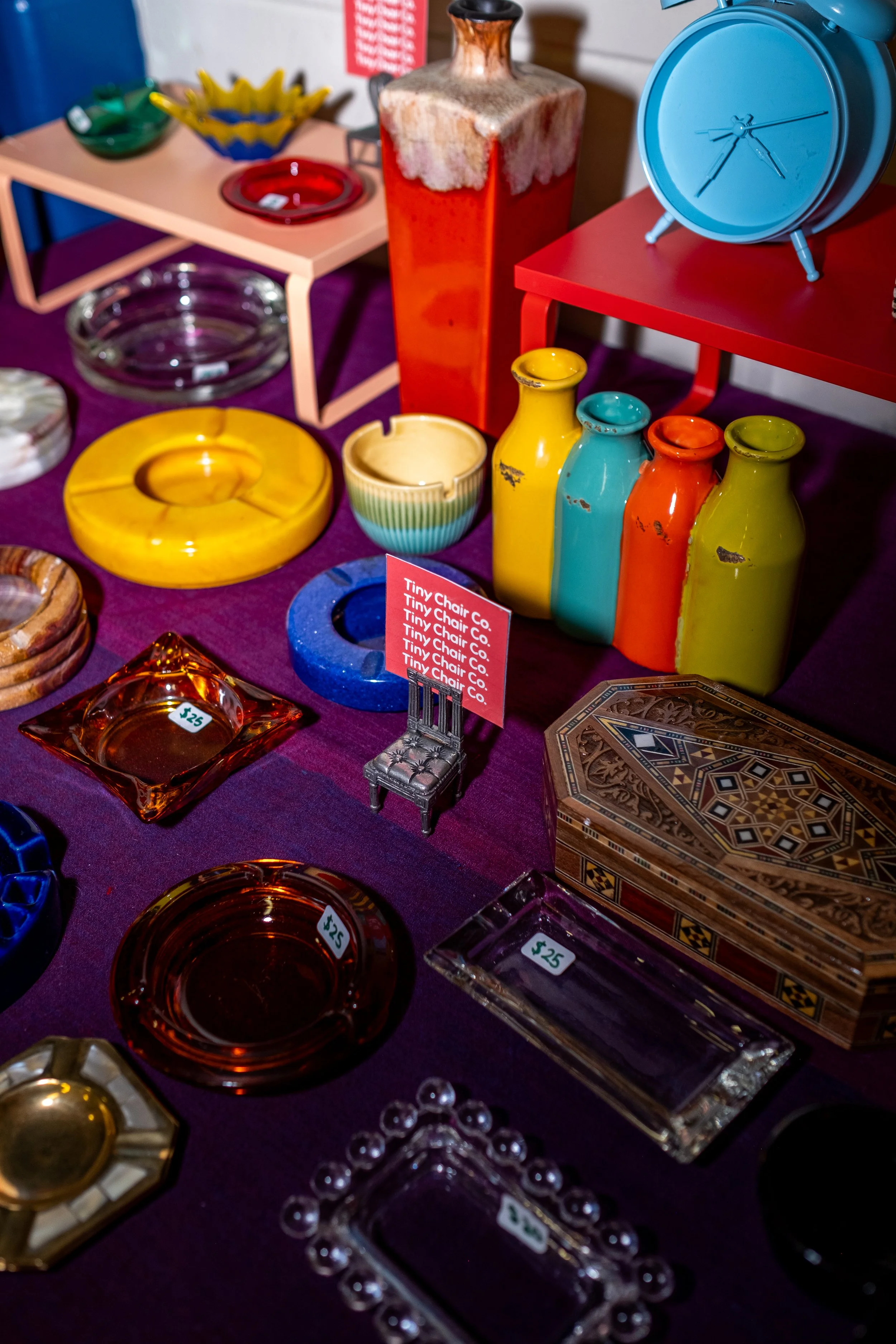 A selection of colorful decor items are on a table.
