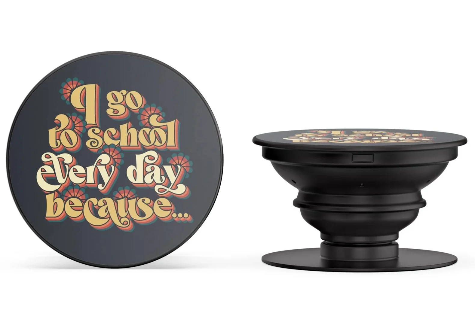 A round black object with a colorful retro-style message that reads, 'I go to school every day because...'. Next to it is a black circular container with a similar design on top.