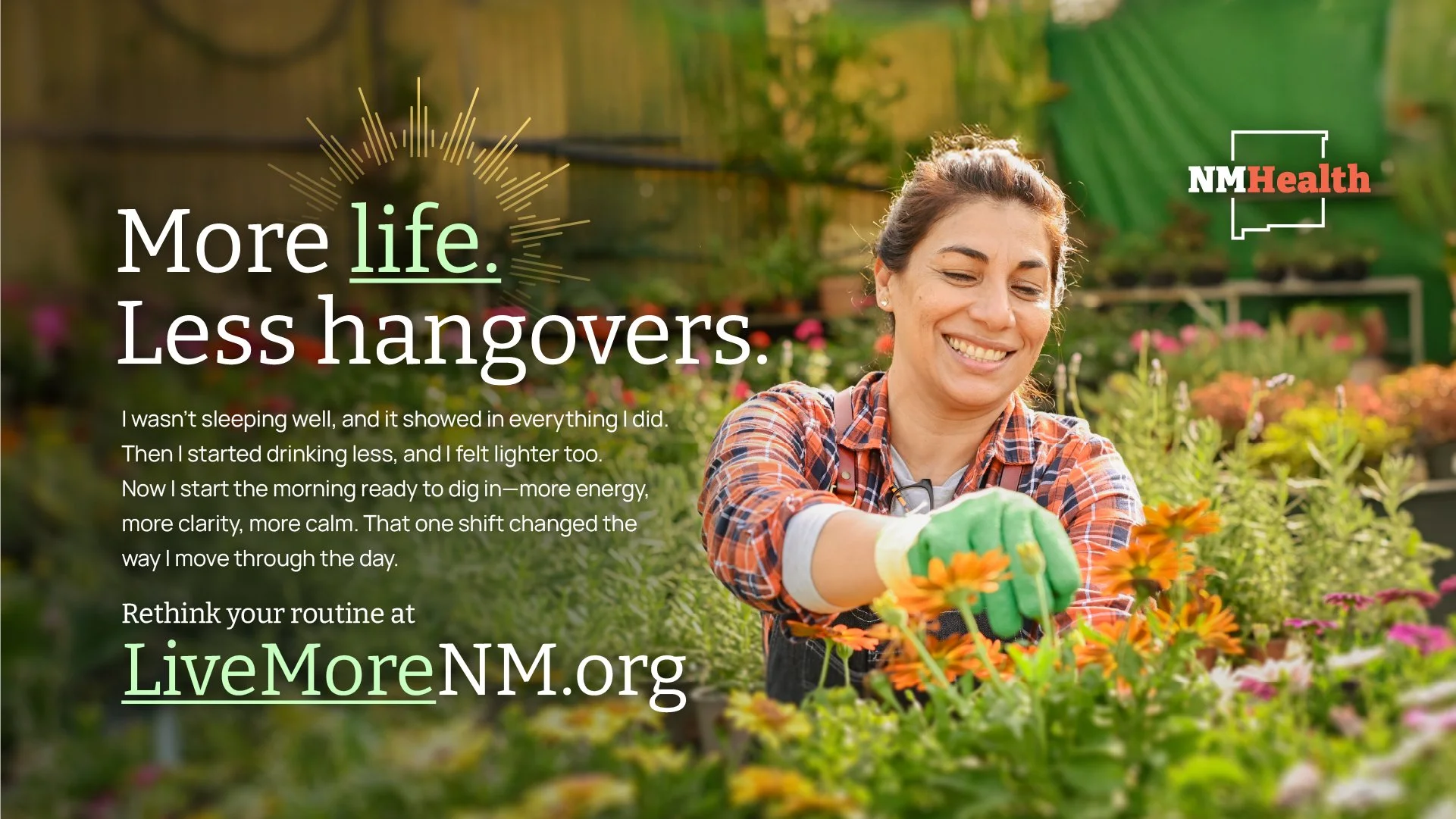 A smiling woman wearing gardening gloves in a greenhouse or garden center, surrounded by colorful flowers and plants, accompanied by the LiveMoreNM.org logo and text promoting healthier living.