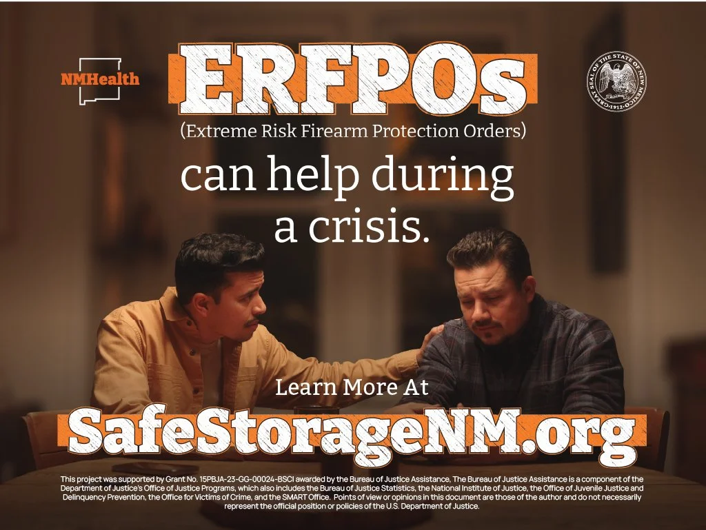A public service announcement poster about firearms and gun safety. It features two men sitting at a table, with one comforting the other. The poster promotes SAFE storage of firearms, with a website link to SafeStorageNM.org and includes logos from 