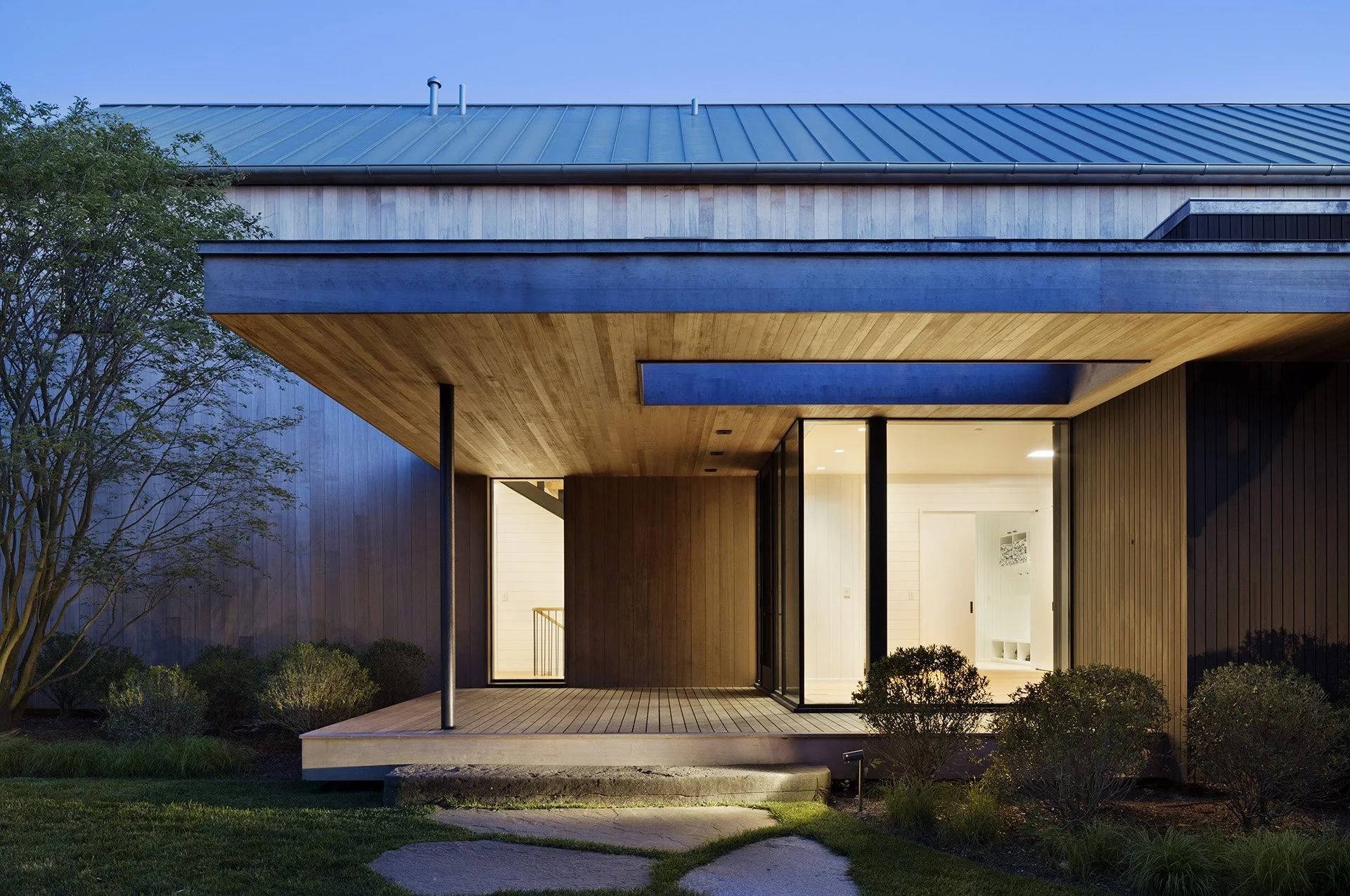 Exterior of East Lake residence in Montauk, featuring lighting design by Tirschwell Lighting, designed by Robert Young.