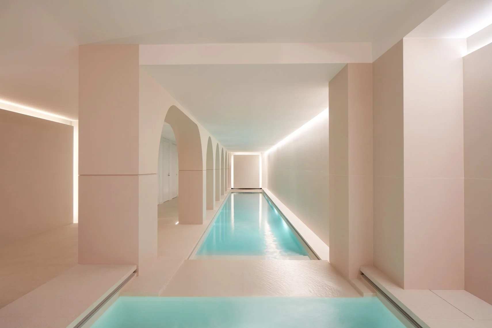 Indoor pool at Central Park West residence, New York, featuring lighting design by Tirschwell Lighting, designed by William Leeds.