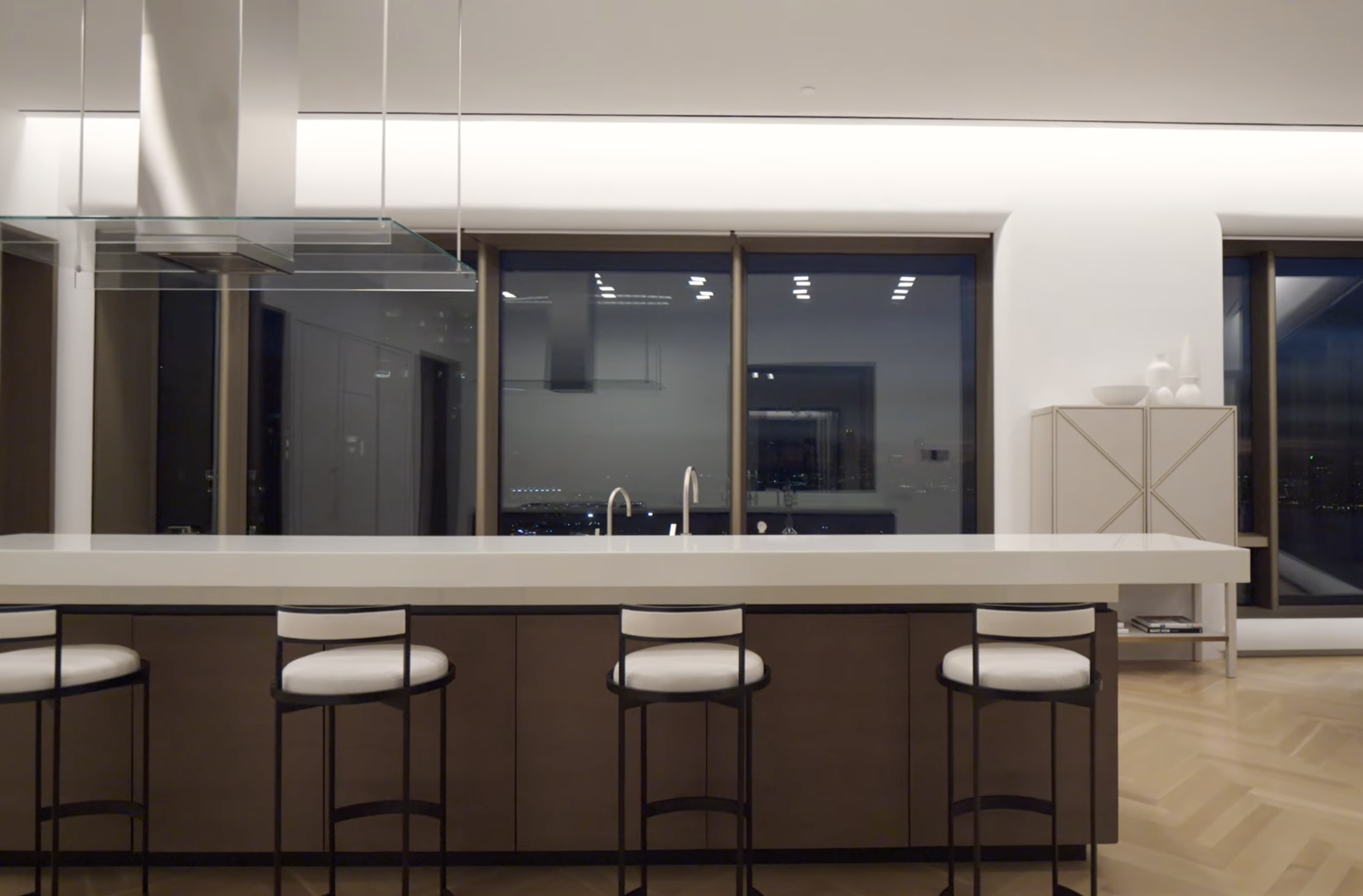 Kitchen of a west Chelsea penthouse, New York, featuring lighting design by Tirschwell Lighting and architecture by Tadao Ando.