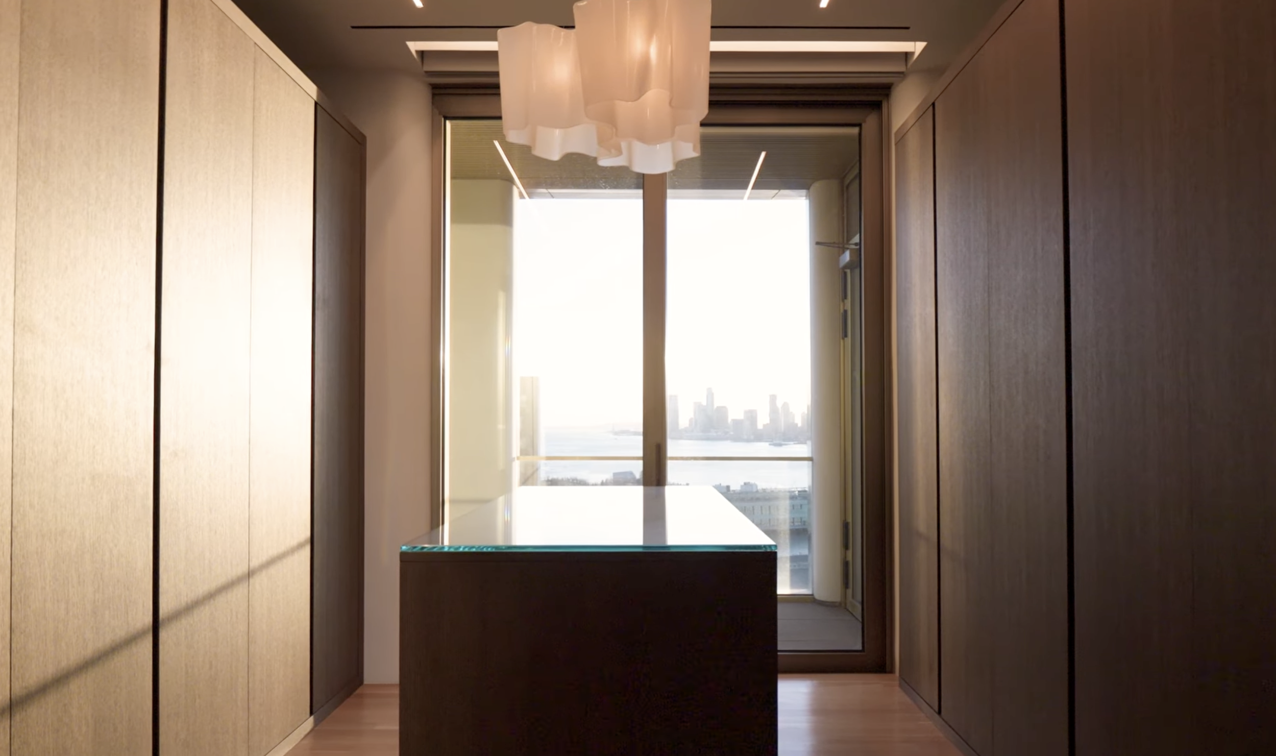 Dressing room of a West Chelsea penthouse in New York, featuring lighting design by Tirschwell Lighting, designed by Tadao Ando.