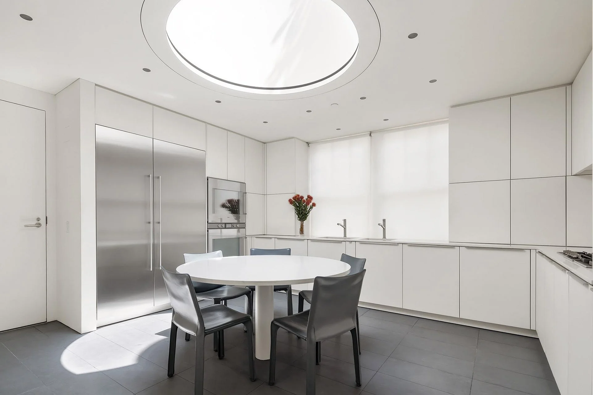 Kitchen interior of E72nd Street penthouse in New York, featuring lighting design by Tirschwell Lighting, designed by Tadao Ando.
