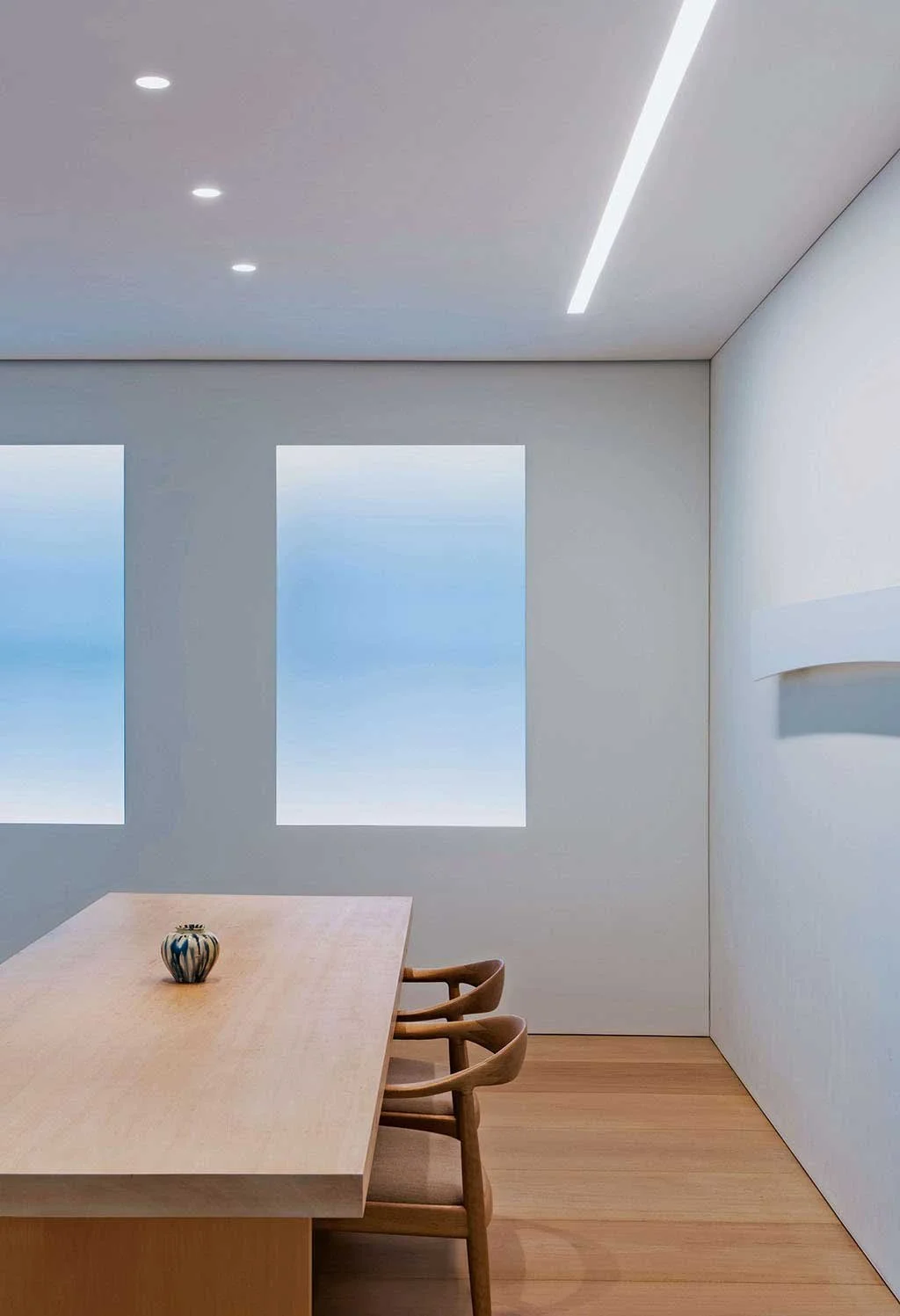 Living room interior showcasing lighting design by Tirschwell Lighting in E72nd Street penthouse, New York, designed by Tadao Ando.