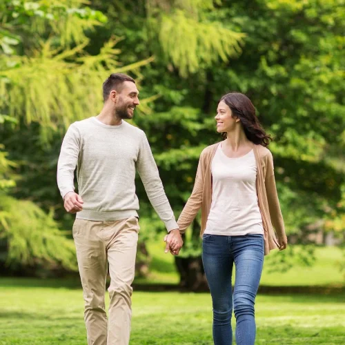 young couple walking hand in hand