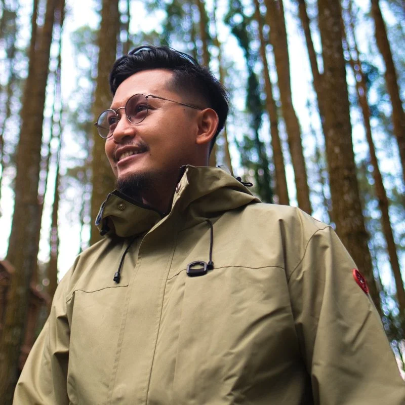 a young man on a trail