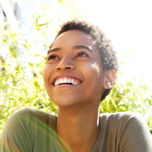 woman looking up and smiling